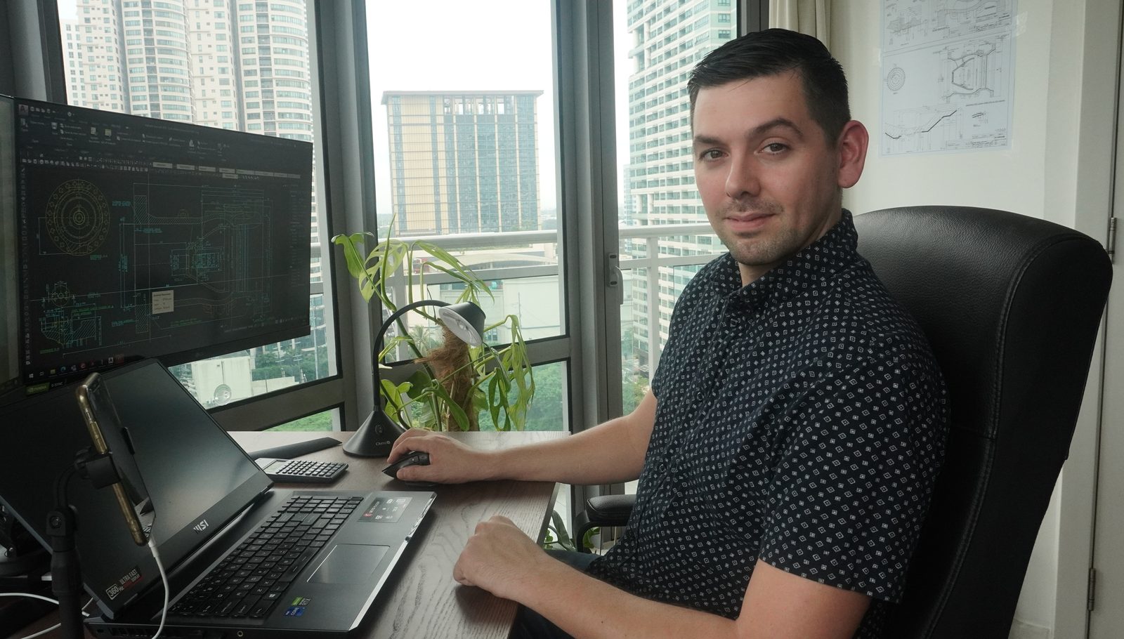 Jim Vergeer working at a two-screen CAD workstation.